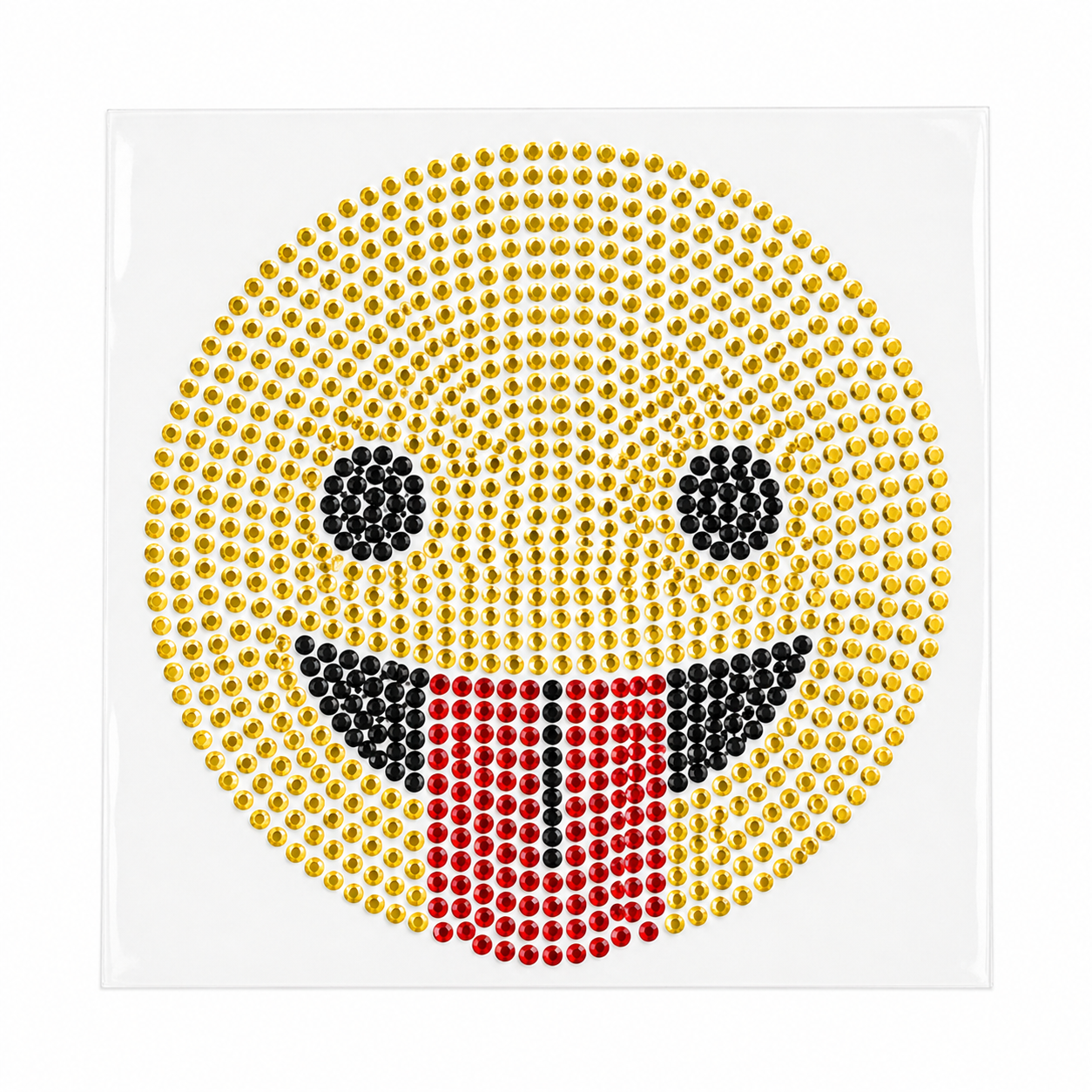 Funny tongue-out emoji rhinestone heat transfer sticker made with yellow, black, and red glass crystal stones for T-shirts, kidswear, bags, and apparel decoration.