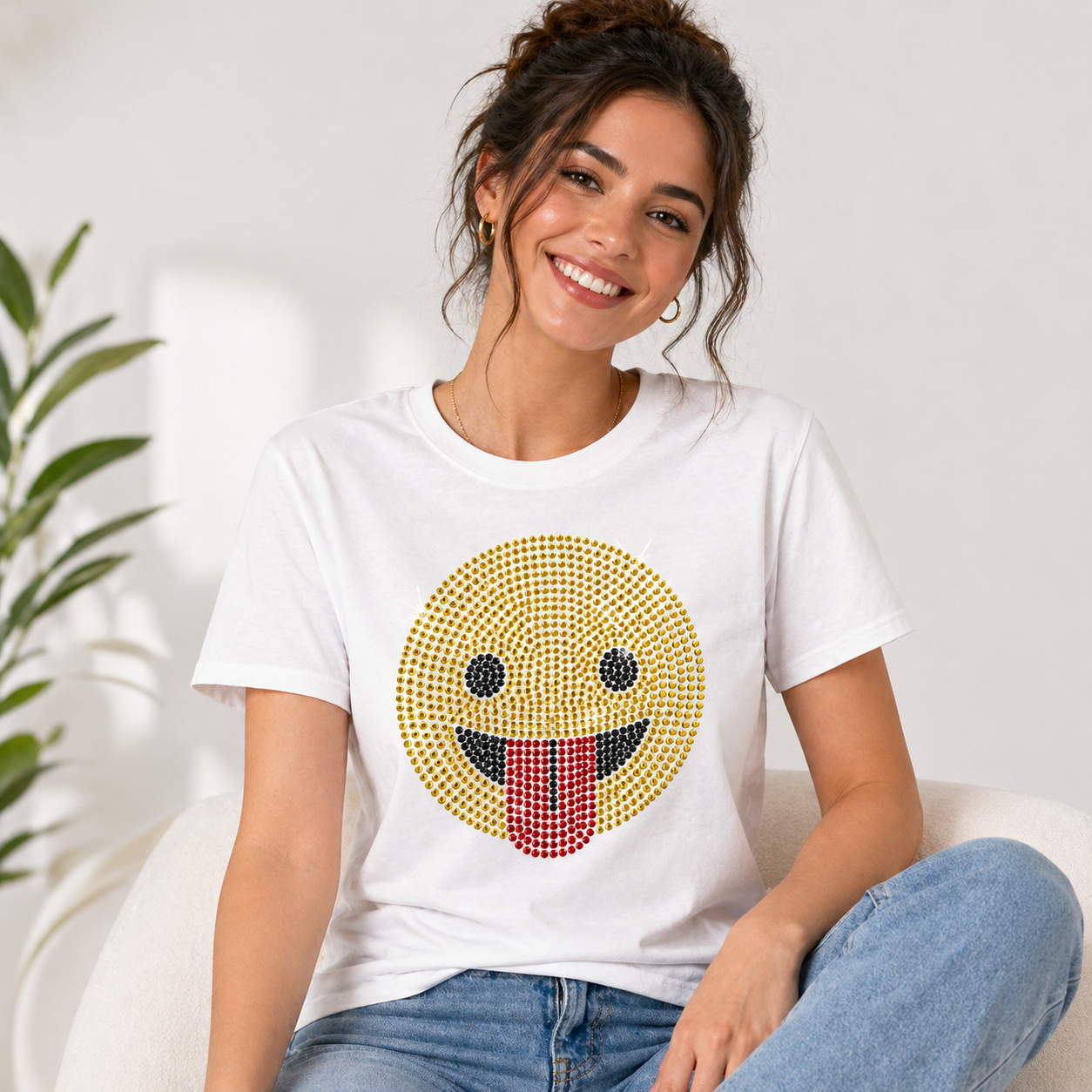 Funny tongue-out emoji rhinestone heat transfer sticker made with yellow, black, and red glass crystal stones for T-shirts, kidswear, bags, and apparel decoration.