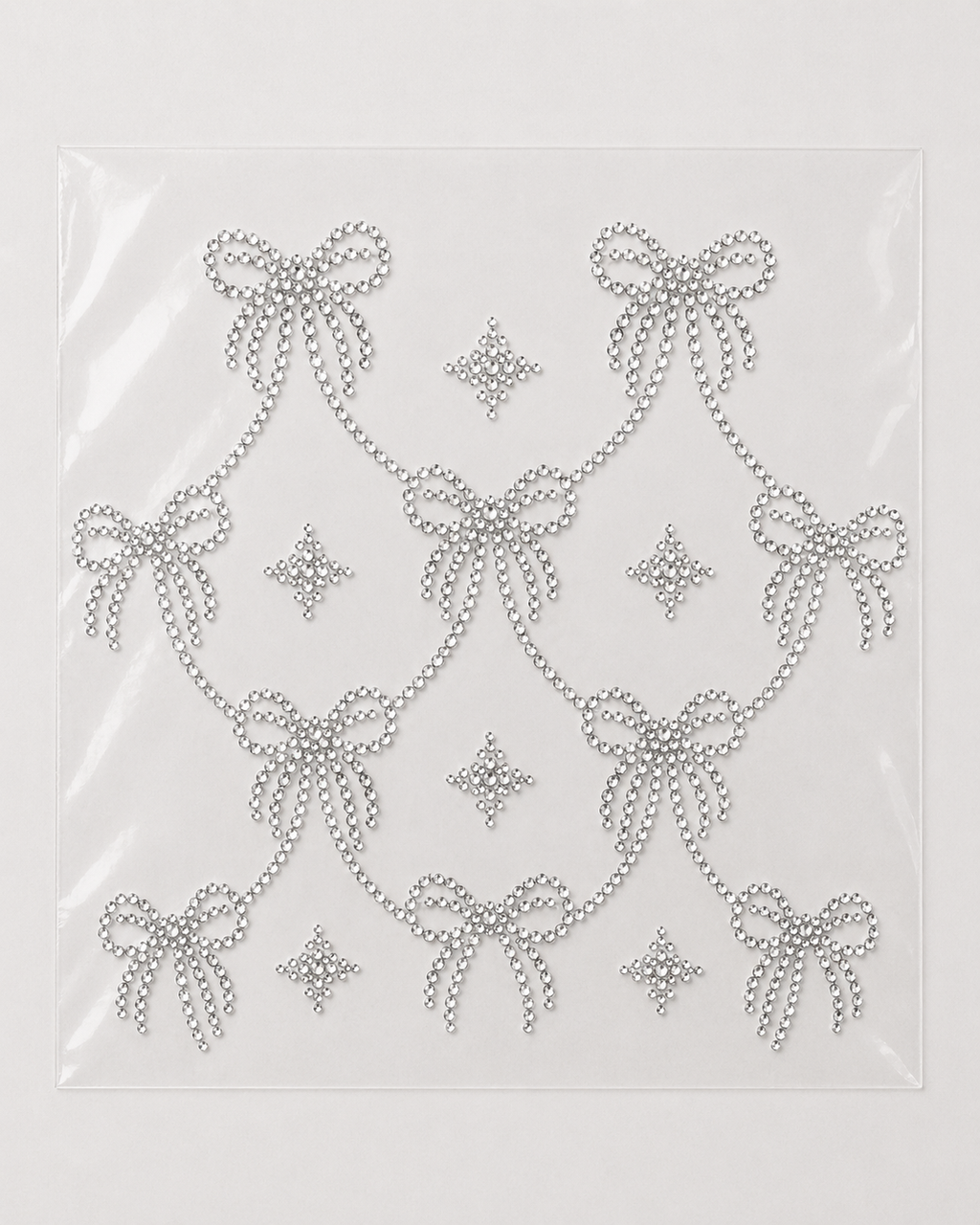 Crystal bow garland rhinestone heat transfer sticker for T-shirts, sweatshirts, dresses, and apparel decoration.